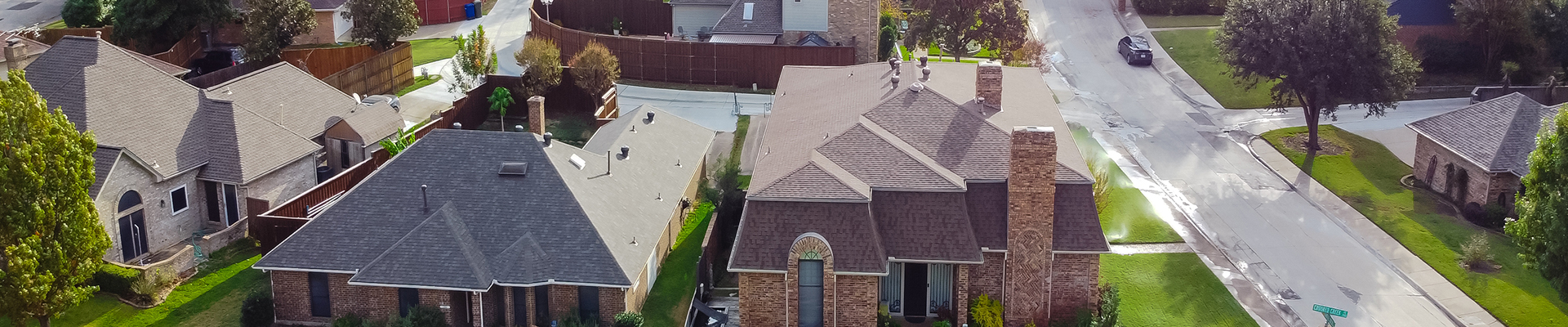 Photo of residential housing community from above the houses in the streets are visi