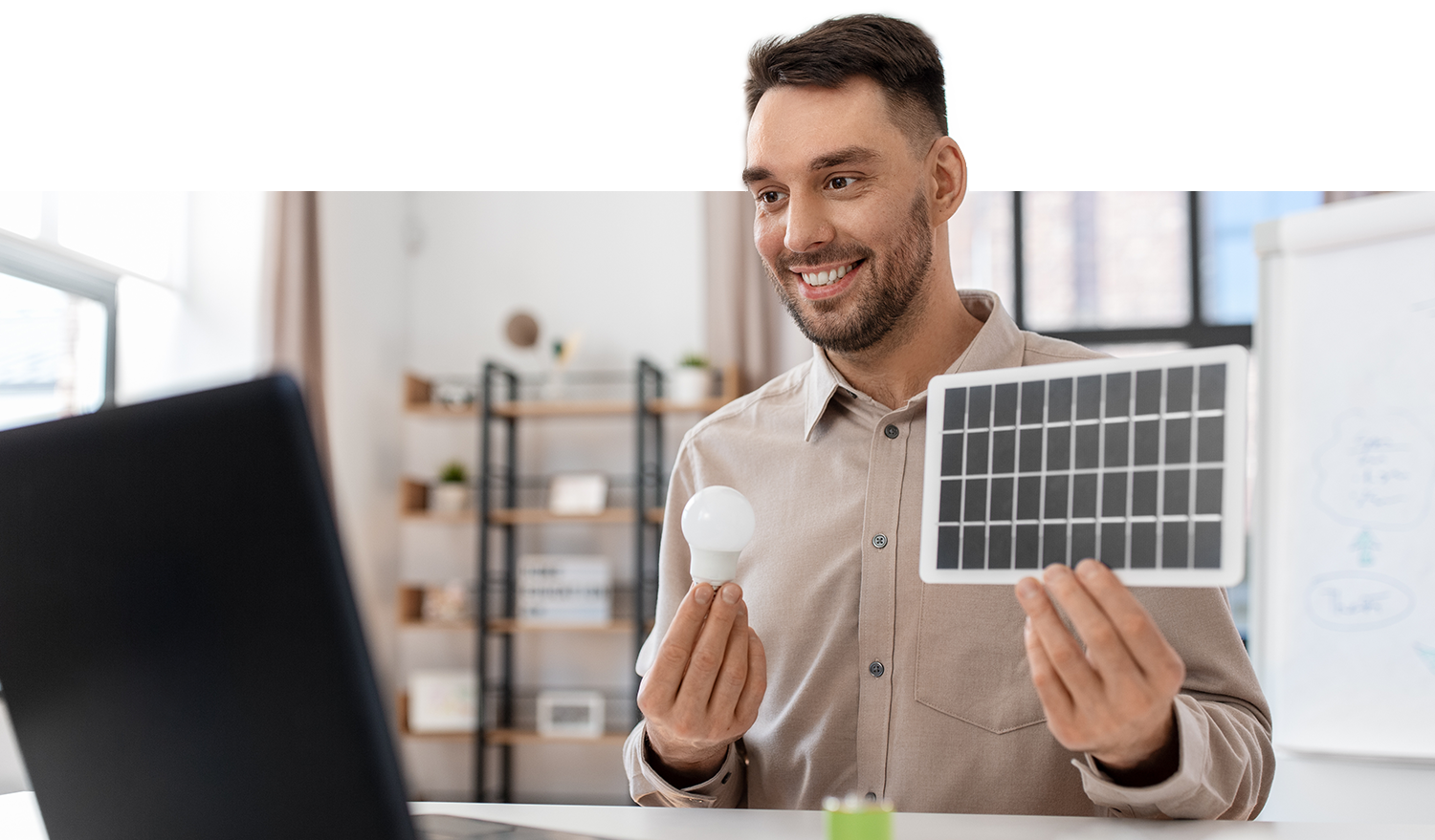 Image of energy solutions specialist explaining solar panel and energy, efficient lightbulbs