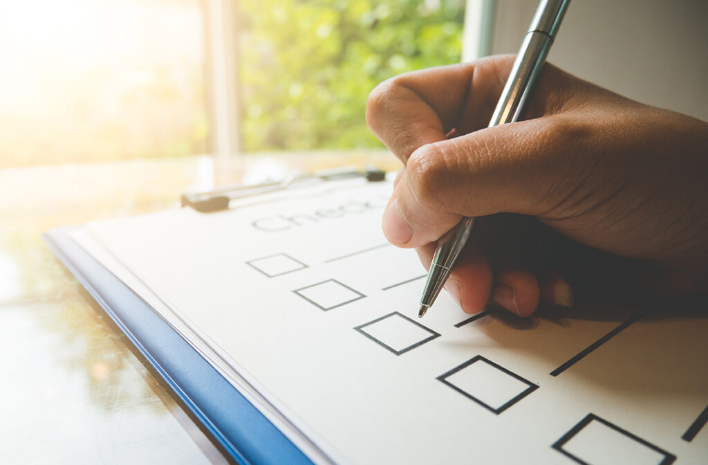 An image of a person writing out a checklist